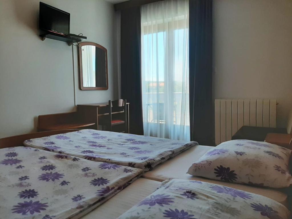 Postel nebo postele na pokoji v ubytování Guest House Katarina