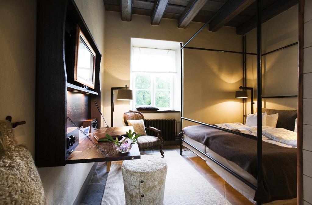 Postel nebo postele na pokoji v ubytování Ulfsunda Slott