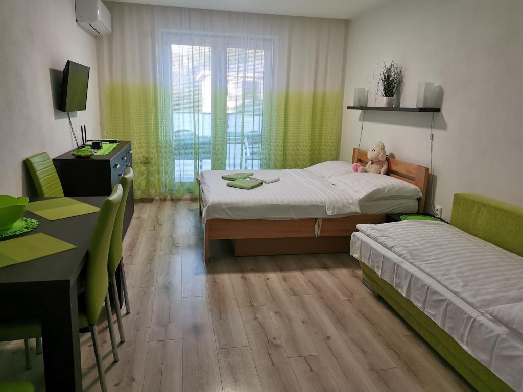 Postel nebo postele na pokoji v ubytování Apartmán Diamond
