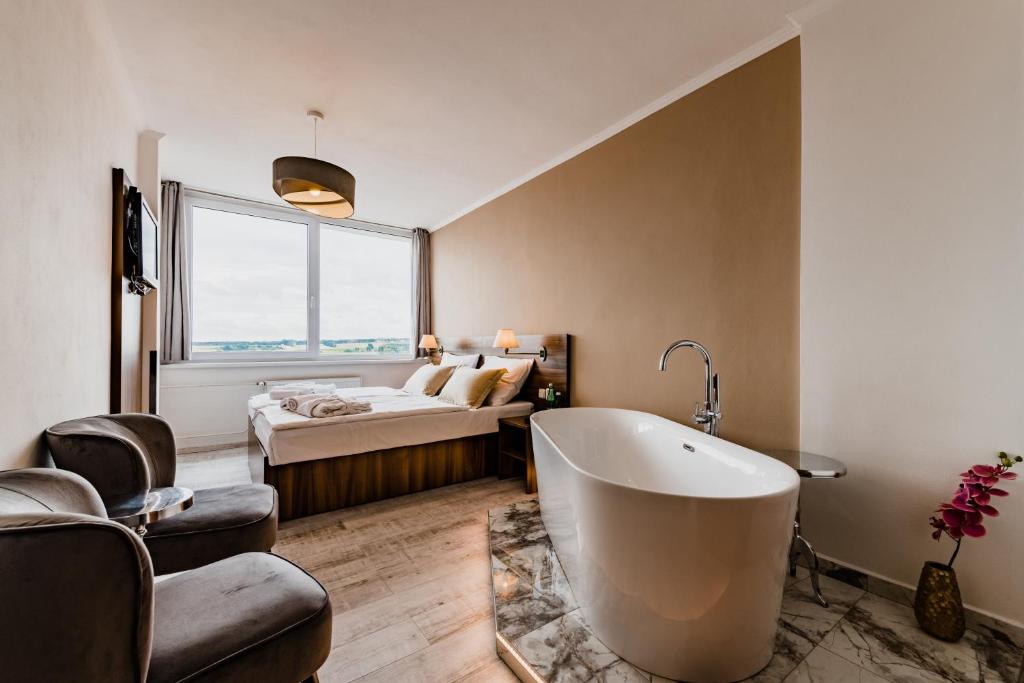 Postel nebo postele na pokoji v ubytování Hotel Palcát