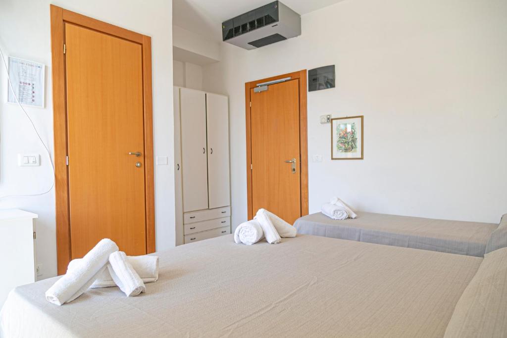 Postel nebo postele na pokoji v ubytování Hotel Royal Inn
