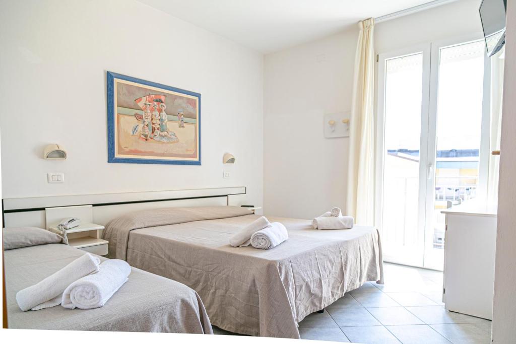 Postel nebo postele na pokoji v ubytování Hotel Royal Inn