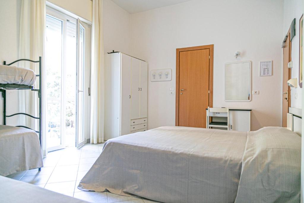 Postel nebo postele na pokoji v ubytování Hotel Royal Inn