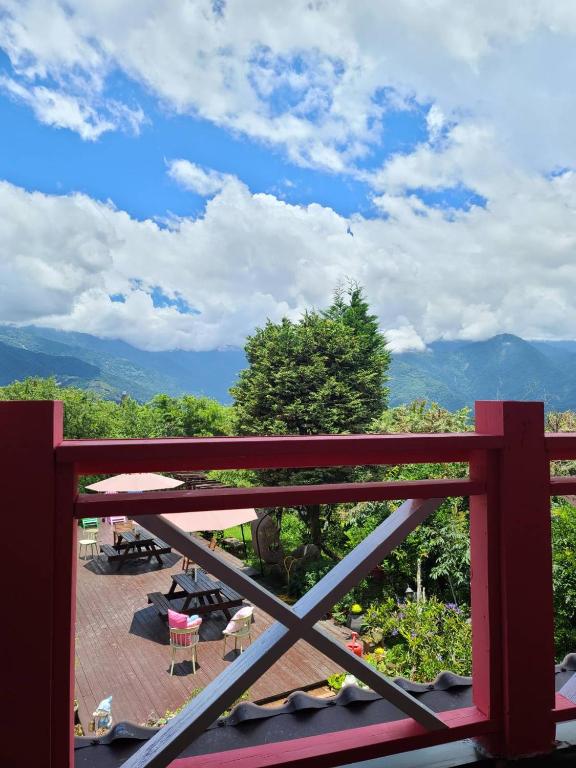 a view from the balcony of a house at Julie&#39;s Garden, Cingjing - Fon Chin Homestay in Ren&#39;ai