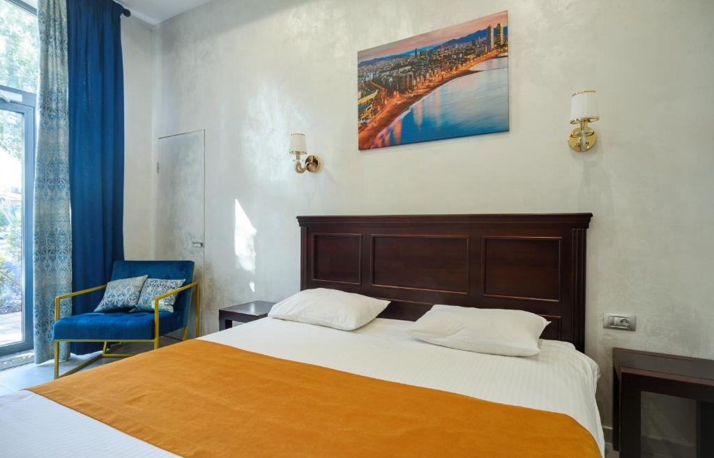 Postel nebo postele na pokoji v ubytování Gaudi stylish hotel