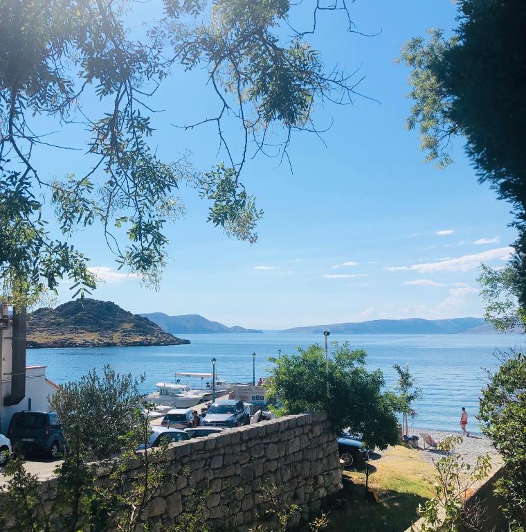 a view of a body of water with cars parked at Nine Sveti Juraj in Sveti Juraj