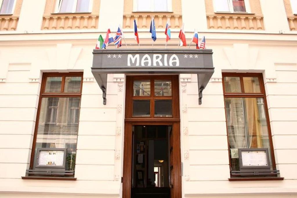 a building with a maria sign on top of it at Hotel Maria in Ostrava