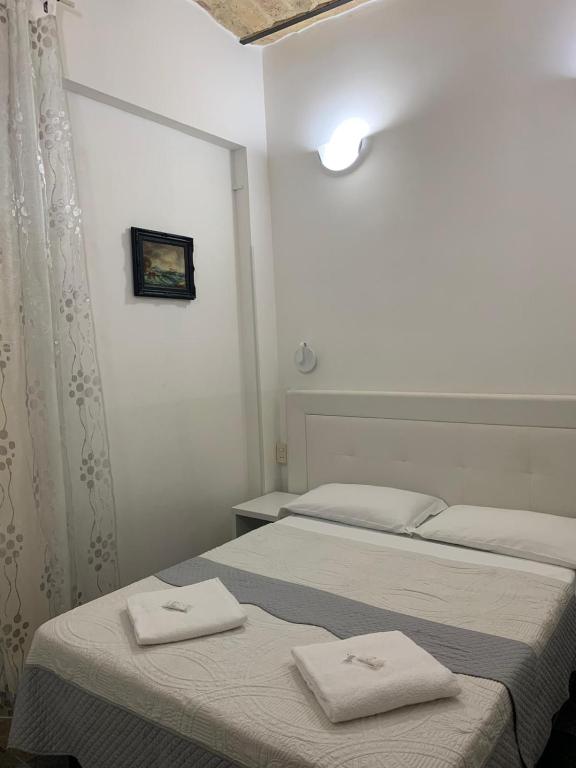 Łóżko lub łóżka w pokoju w obiekcie Golden Nice Apartment