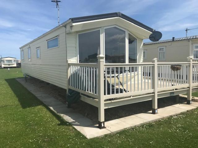 a mobile home with a porch and a deck at G17 The Chase , Ingoldmells, Skegness in Ingoldmells