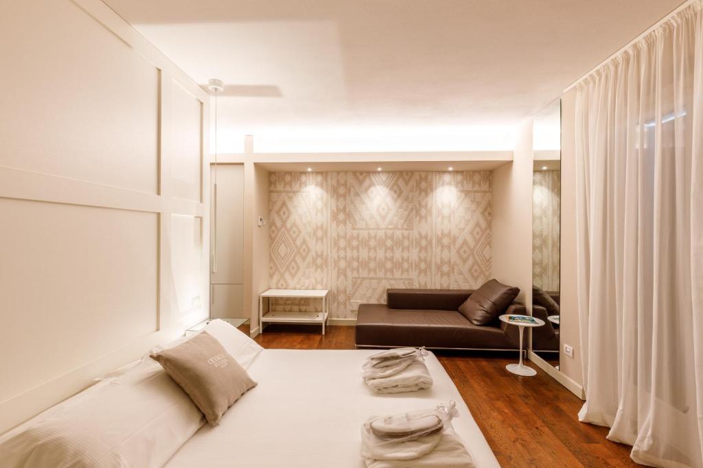 A bed or beds in a room at Quercia Belvedere Relais
