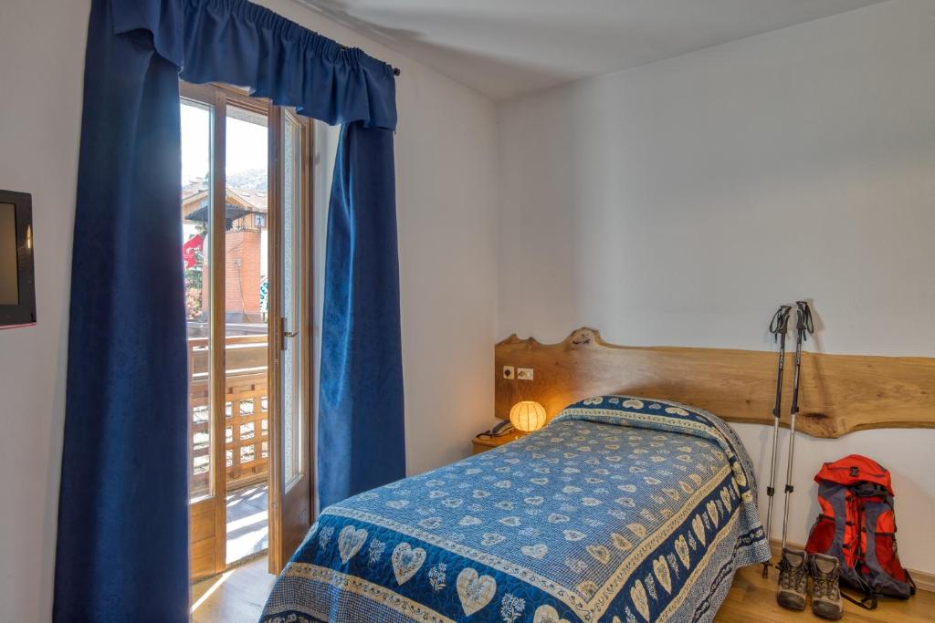 Postel nebo postele na pokoji v ubytování Albergo Moleta