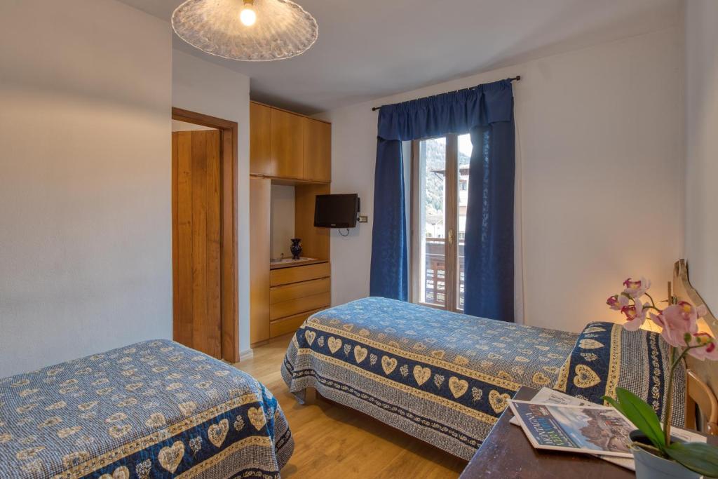 Postel nebo postele na pokoji v ubytování Albergo Moleta
