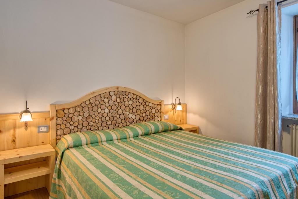 Postel nebo postele na pokoji v ubytování Albergo Moleta