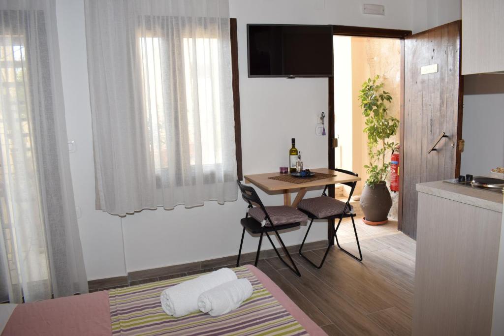 Televízia a/alebo spoločenská miestnosť v ubytovaní Loggia Traditional Suites