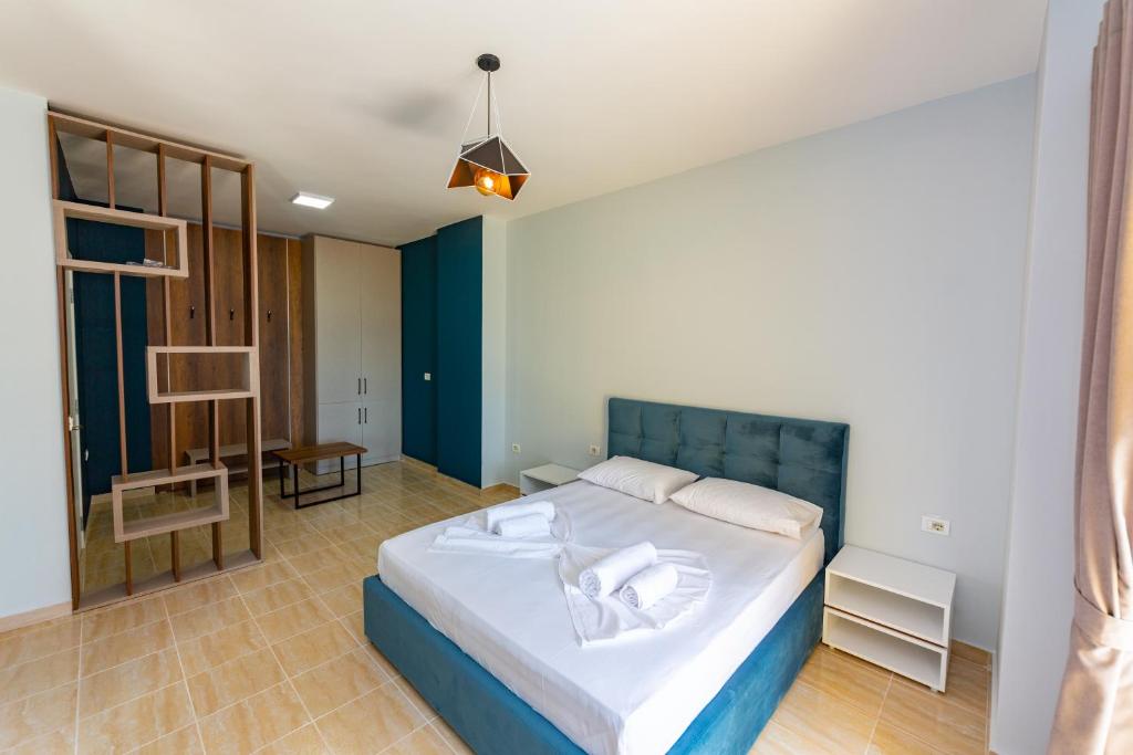 Postel nebo postele na pokoji v ubytování Ponari S Hotel