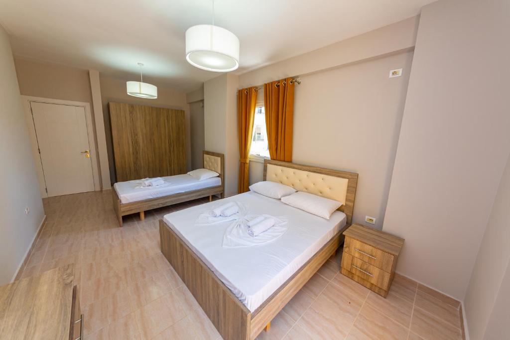 Postel nebo postele na pokoji v ubytování Ponari S Hotel
