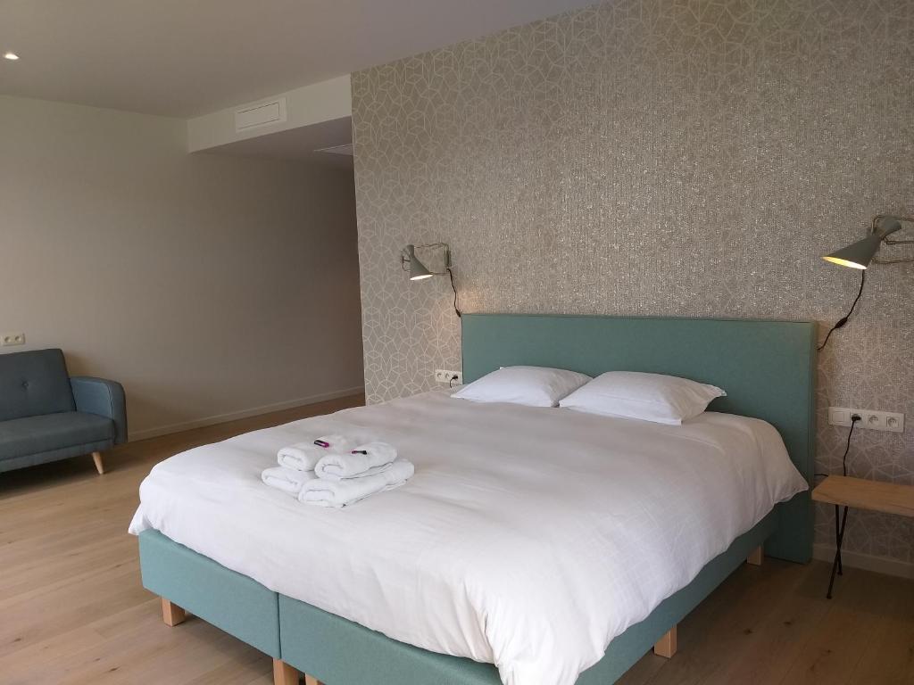 Postel nebo postele na pokoji v ubytování Hotel B - Boskapelhoeve