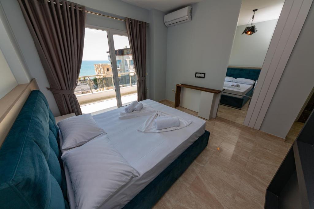 Postel nebo postele na pokoji v ubytování Ponari S Hotel
