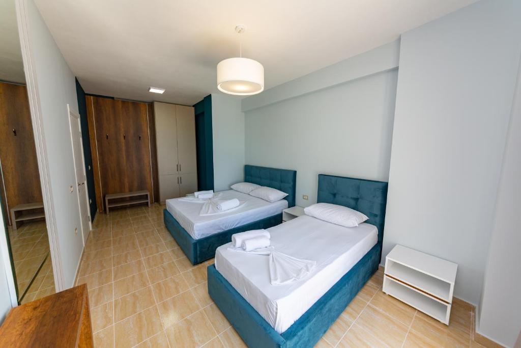 Postel nebo postele na pokoji v ubytování Ponari S Hotel