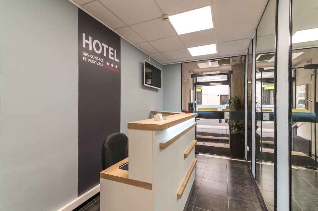 a lobby of a hotel with a reception desk at Hotel des Congrès et Festivals in Cannes