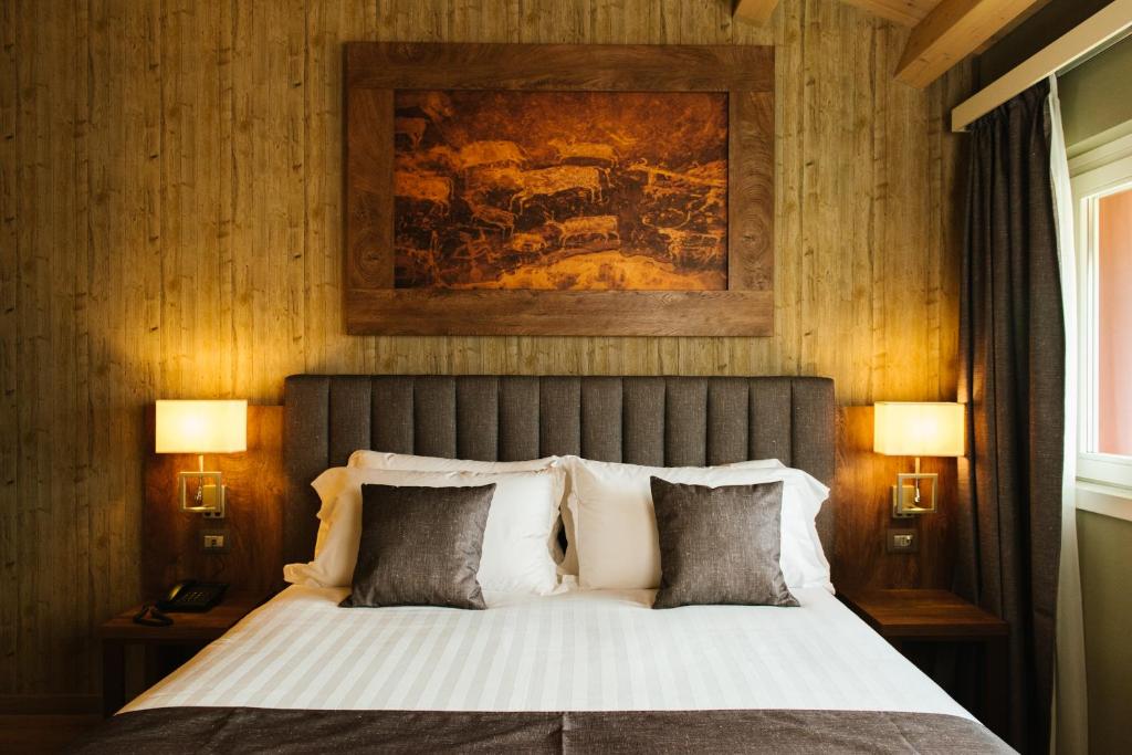 Postel nebo postele na pokoji v ubytování Lake Hotel La Pieve