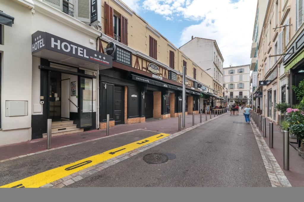 an empty street in a city with buildings at Hotel des Congrès et Festivals in Cannes