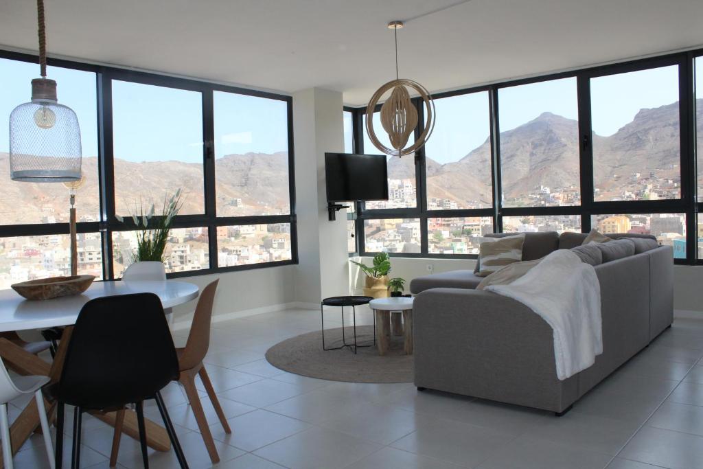 a living room with a couch and a table at Harmony apartment in Mindelo São Vicente in Mindelo