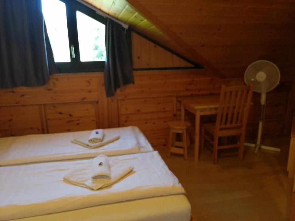 Postel nebo postele na pokoji v ubytování Casa Ninfea Panzió