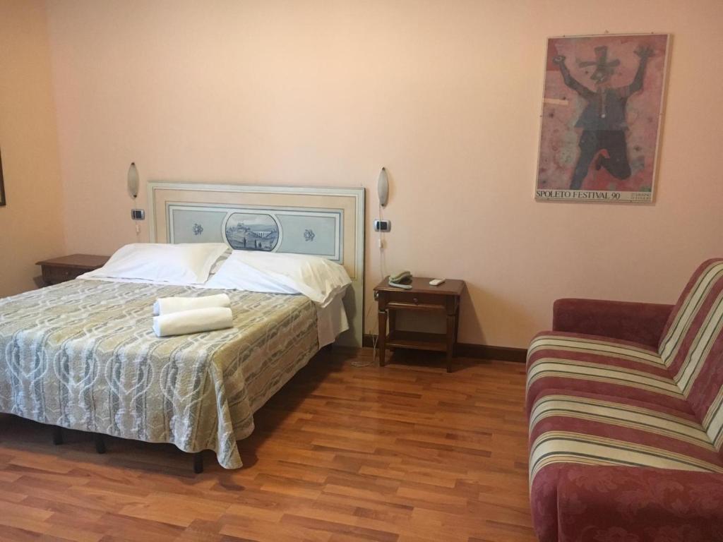 Postel nebo postele na pokoji v ubytování Ospitalità Collicola
