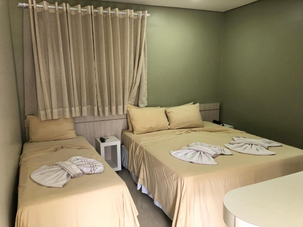Postel nebo postele na pokoji v ubytování Hotel Roni