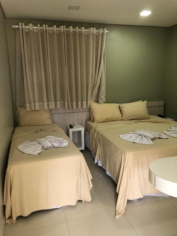 Postel nebo postele na pokoji v ubytování Hotel Roni