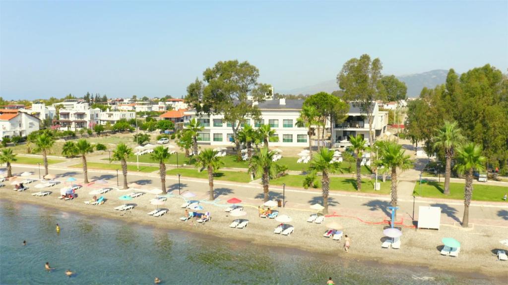 an aerial view of a beach with umbrellas at Dolunay Suit & Beach in Muğla