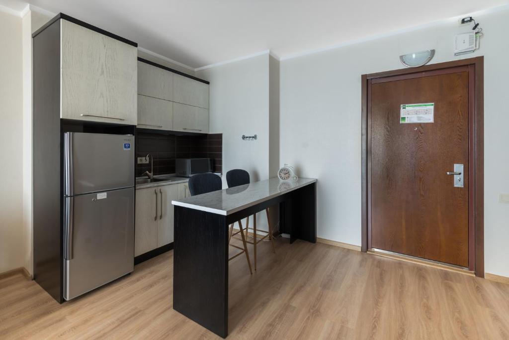 Kuchyň nebo kuchyňský kout v ubytování Orbi Residence Hotel Official