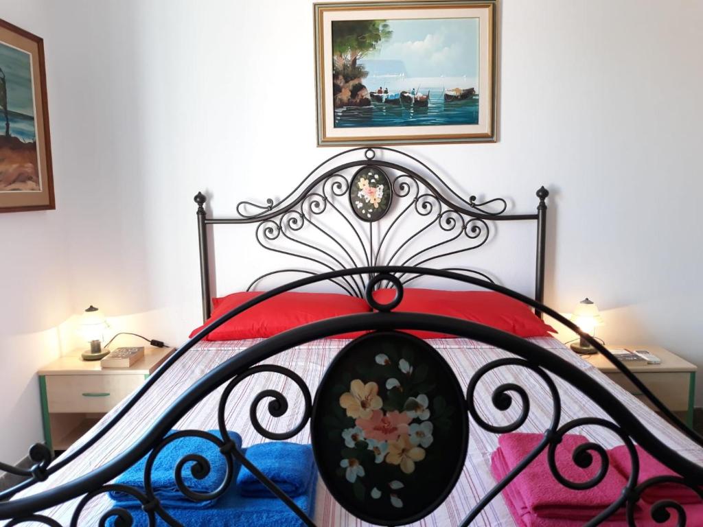 A bed or beds in a room at L' Attico