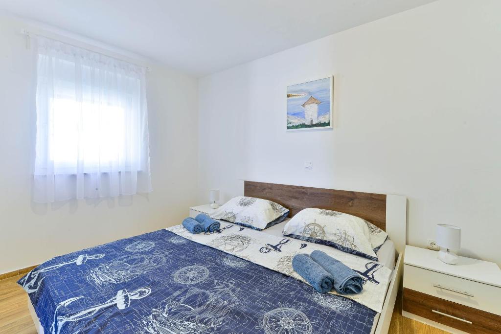 Postel nebo postele na pokoji v ubytování Apartman Duje 2