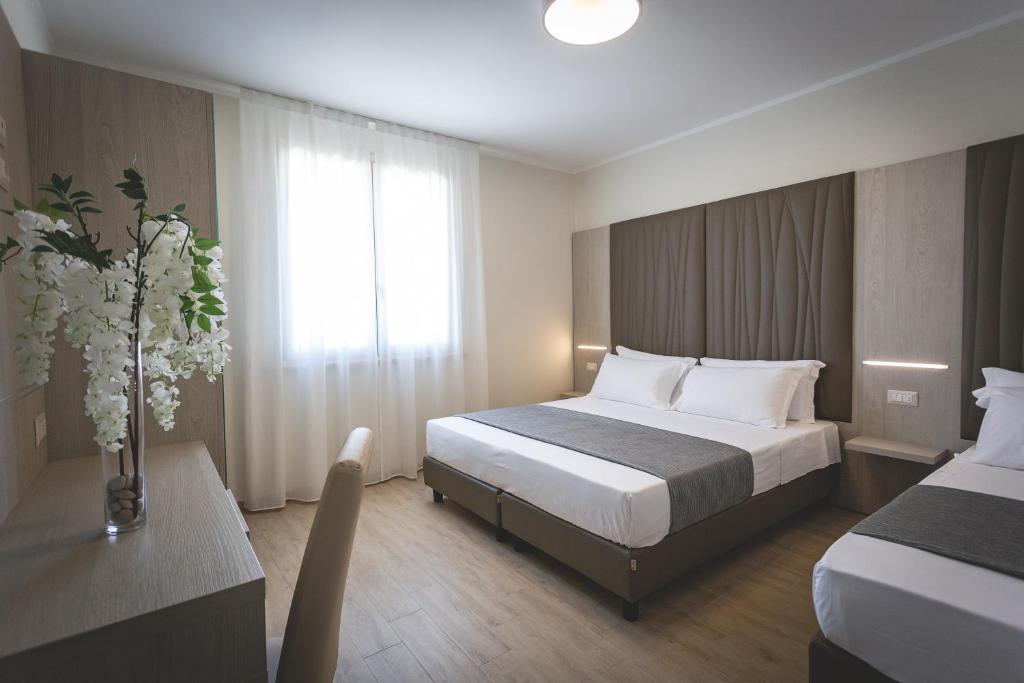 Postel nebo postele na pokoji v ubytování Hotel Residence Vallecorsa