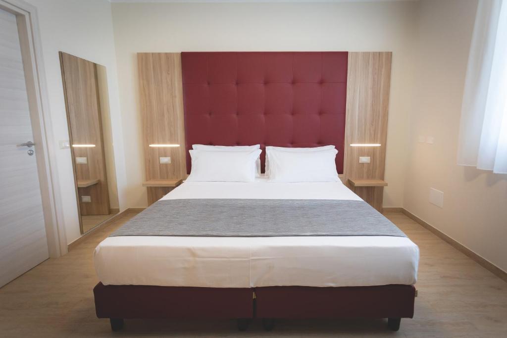 Postel nebo postele na pokoji v ubytování Hotel Residence Vallecorsa
