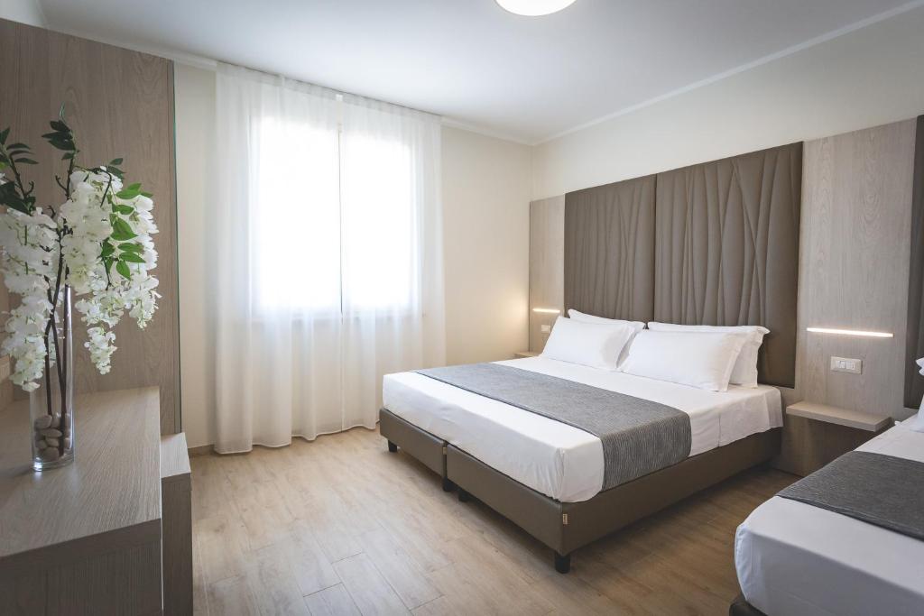 En eller flere senge i et værelse på Hotel Residence Vallecorsa