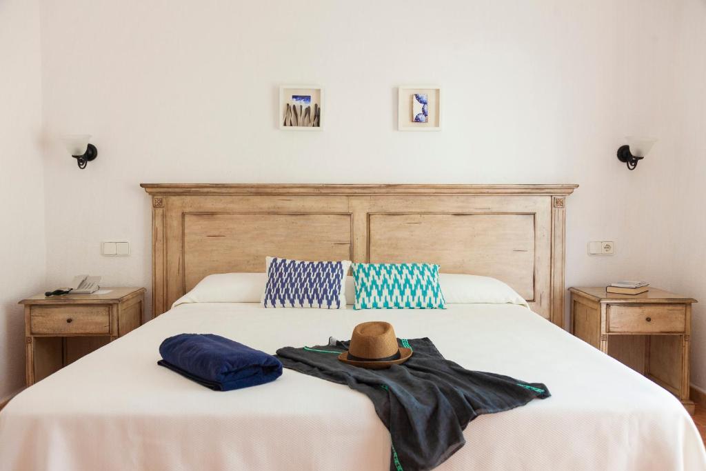 Postel nebo postele na pokoji v ubytování Hotel Roca Plana