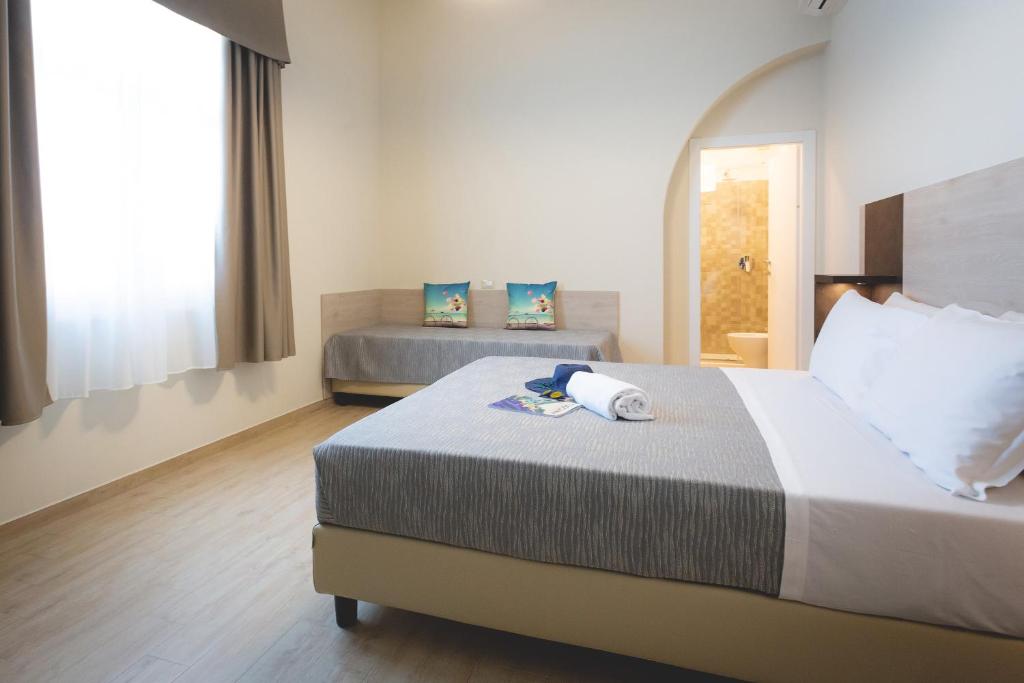 Postel nebo postele na pokoji v ubytování Hotel Residence Vallecorsa
