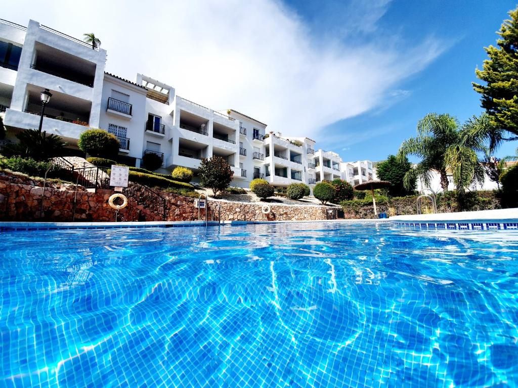 a large swimming pool in front of a building at Vista Alhaurin Golf in Alhaurín el Grande