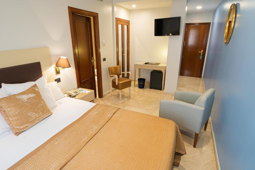 TV a/nebo společenská místnost v ubytování Hotel Sancho