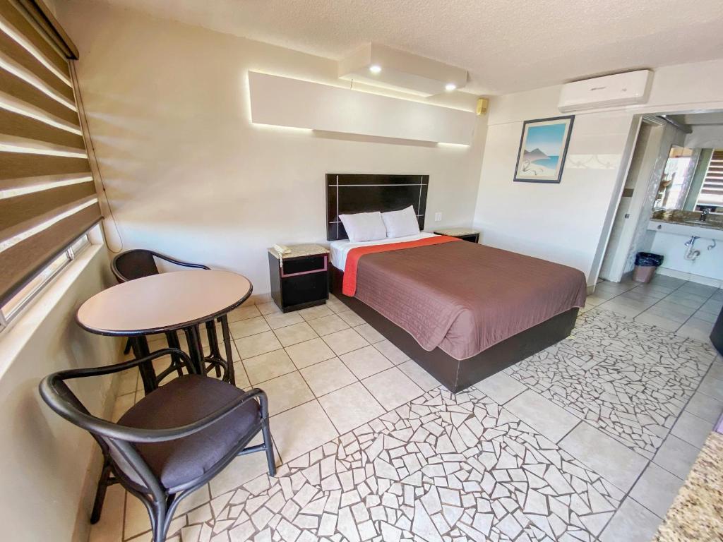 Postel nebo postele na pokoji v ubytování Motel Reno