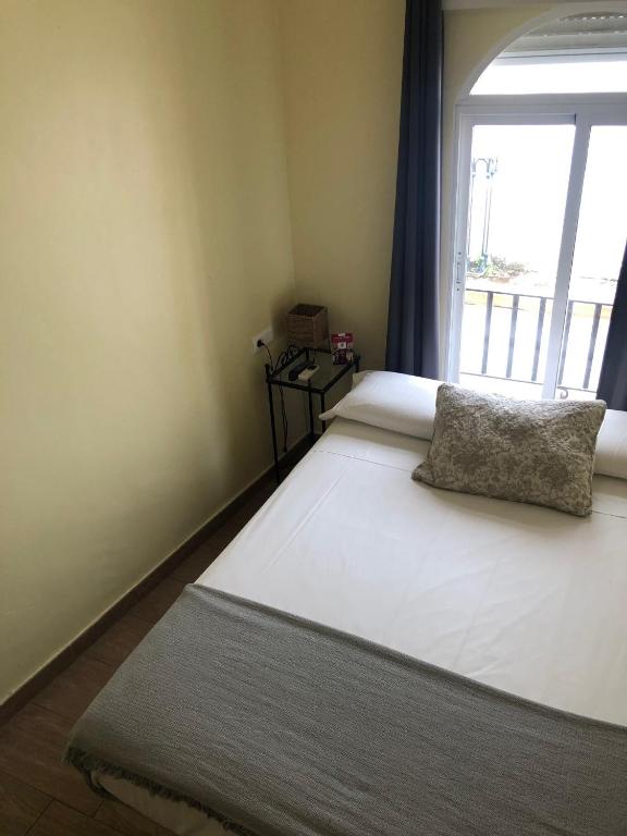 Cama o camas de una habitación en Hospedería Luis de Góngora