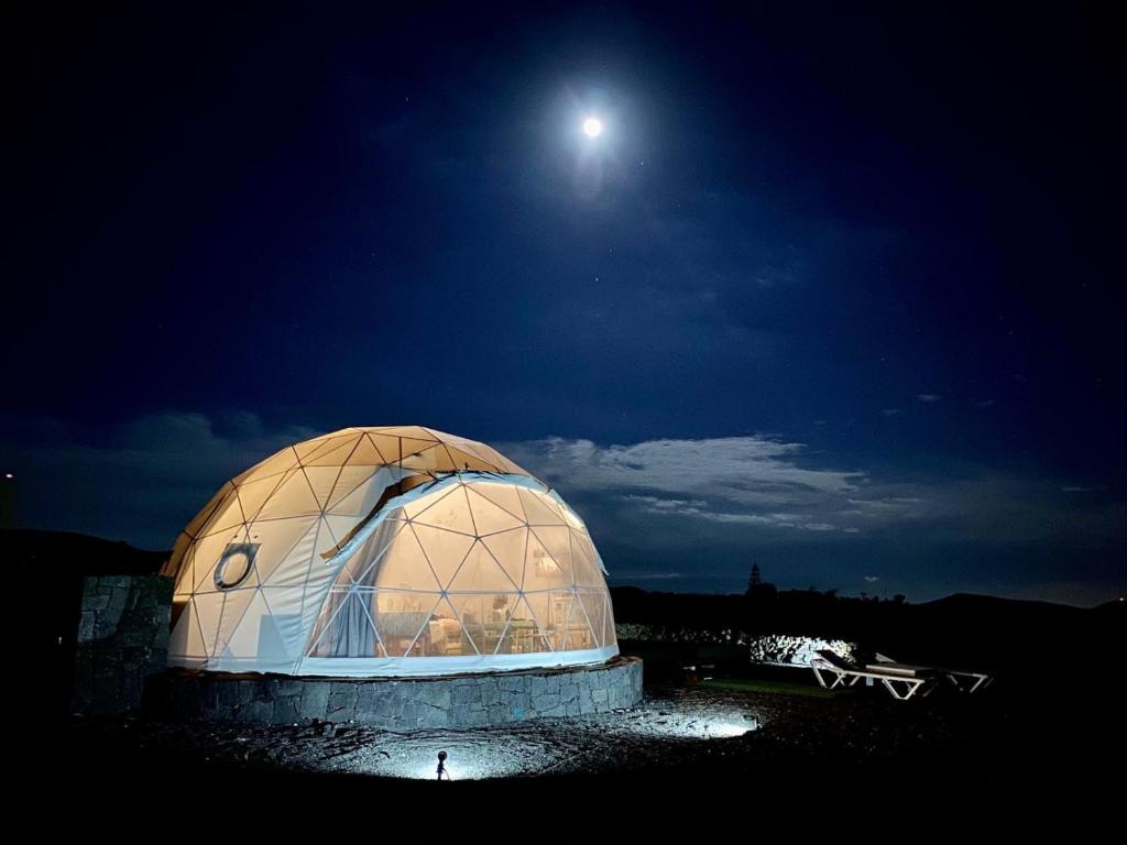 a domed observatory with the moon in the sky at Eslanzarote Eco Dome Experience in Teguise
