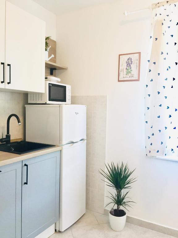 Kuchyň nebo kuchyňský kout v ubytování Holiday Home Casa Bianca