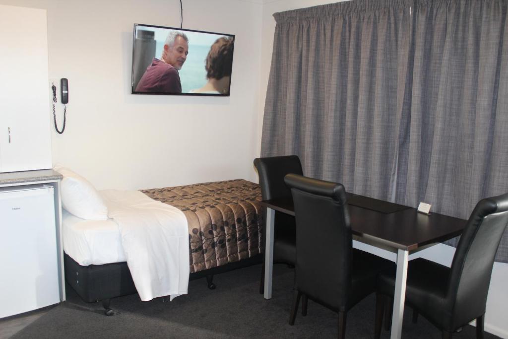 Postel nebo postele na pokoji v ubytování Riverlea Motel