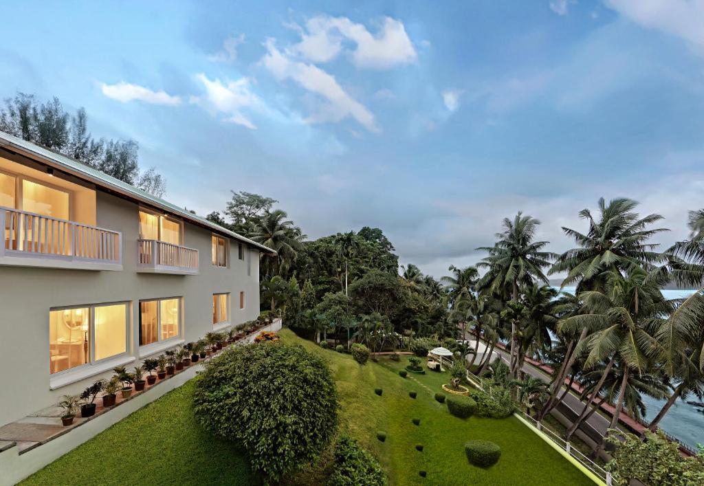 an aerial view of a house with a garden at Welcomhotel by ITC Hotels, Bay Island, Port Blair in Port Blair
