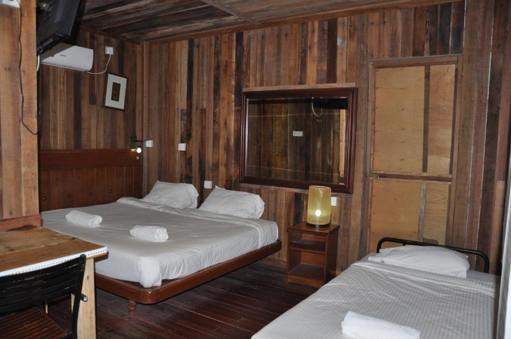 Postel nebo postele na pokoji v ubytování Joe Fisherman Inn