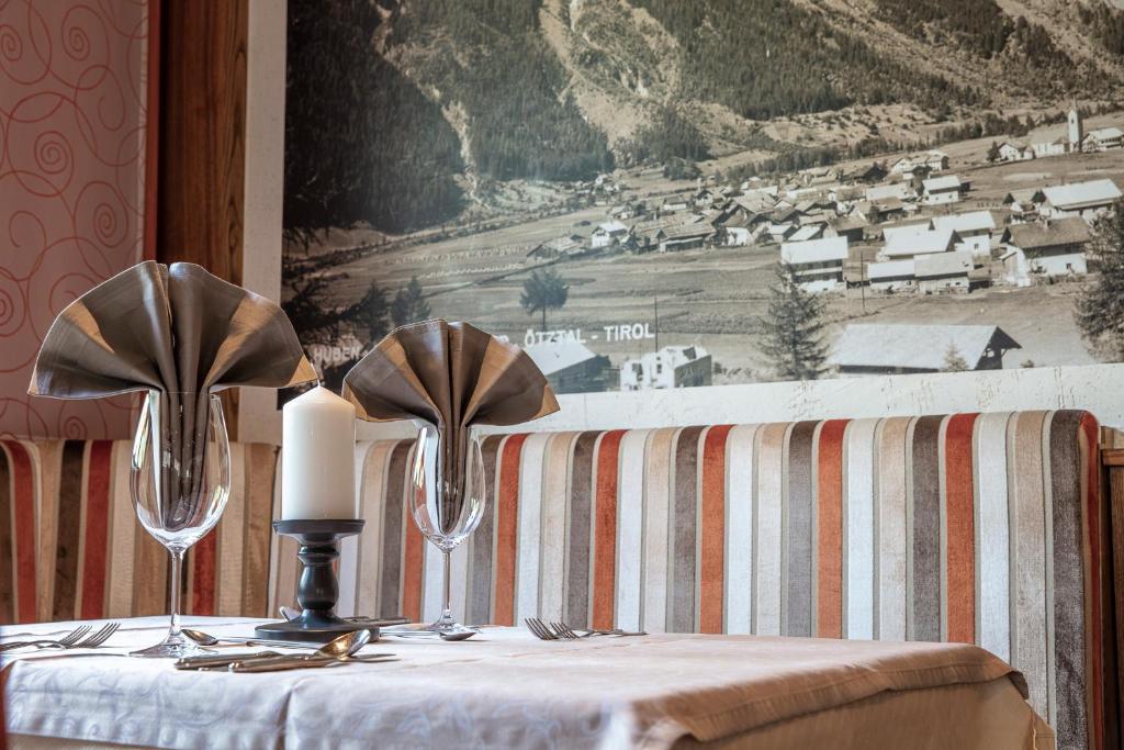 Postel nebo postele na pokoji v ubytování Genusshotel Alpenblick